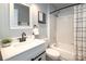 This bright bathroom features modern fixtures and a shower-tub combo at 501 Olmsted Park Pl # N, Charlotte, NC 28203