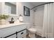Bathroom features a white vanity, an elegant faucet, and shower-tub combo at 501 Olmsted Park Pl # N, Charlotte, NC 28203