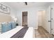 Bedroom featuring a doorway to the ensuite bathroom and a walk in closet at 501 Olmsted Park Pl # N, Charlotte, NC 28203