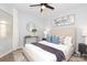 Bright bedroom boasts an accent wall art, ceiling fan, and ample natural light at 501 Olmsted Park Pl # N, Charlotte, NC 28203
