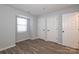 Bright bedroom with natural light, vinyl floors, and painted in neutral colors at 501 Olmsted Park Pl # N, Charlotte, NC 28203