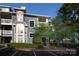Charming blue condo with balconies, complemented by mature trees and professional landscaping at 501 Olmsted Park Pl # N, Charlotte, NC 28203