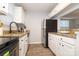 Kitchen with granite counters, stainless steel appliances, and a breakfast bar at 501 Olmsted Park Pl # N, Charlotte, NC 28203