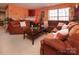 Inviting living room featuring comfortable seating, a fireplace, and ample natural light at 5127 Fernhill Dr, Charlotte, NC 28217