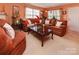 Comfortable living room with plush couches, a decorative coffee table and natural light from the windows at 5127 Fernhill Dr, Charlotte, NC 28217