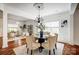 Elegant dining room with a chandelier, hardwood floors, and stylish decor perfect for gatherings at 5713 Falkirk Ln, Matthews, NC 28104