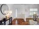 Bright foyer with hardwood floors, white walls, and modern decor, creating a welcoming entrance at 5713 Falkirk Ln, Matthews, NC 28104