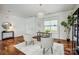 Bright home office featuring hardwood floors, natural light, and neutral decor for a productive workspace at 5713 Falkirk Ln, Matthews, NC 28104
