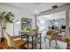 Well-lit home office with hardwood floors, a modern desk, and a view into the dining area at 5713 Falkirk Ln, Matthews, NC 28104