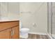 Bathroom featuring cherry wood vanity, toilet, and tiled walk-in shower at 5850 Strathmore Ct, Charlotte, NC 28215