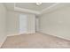 Bedroom showcasing neutral walls, neutral carpet, and a closet at 5850 Strathmore Ct, Charlotte, NC 28215