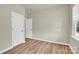 Bright bedroom with a closet and hardwood flooring, offering a comfortable retreat at 5850 Strathmore Ct, Charlotte, NC 28215