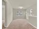 Bonus room featuring neutral walls, neutral carpet, and natural light at 5850 Strathmore Ct, Charlotte, NC 28215