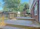 Large back deck with weathered wood and views of the yard and surrounding trees at 6430 Farmingdale Dr, Charlotte, NC 28212