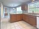 Kitchen featuring a center island, granite countertops, and a tile floor at 6430 Farmingdale Dr, Charlotte, NC 28212