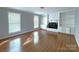 Spacious living room features hardwood floors, fireplace and built-in shelving at 6430 Farmingdale Dr, Charlotte, NC 28212