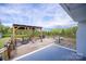 Wooden deck with a pergola, seating area, and outdoor table at 6599 Mcintosh Rd, Stanley, NC 28164