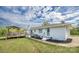 Exterior view of the home showing backyard with deck and patio area at 6599 Mcintosh Rd, Stanley, NC 28164