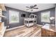 This bedroom features hardwood floors, gray walls, a window, and a custom-built bunk bed at 6599 Mcintosh Rd, Stanley, NC 28164