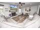 Cozy living room with fireplace, TV, guitars, piano, and gray sectional couch at 6599 Mcintosh Rd, Stanley, NC 28164