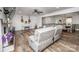 Open concept living room featuring fireplace, TV, piano, gray sectional, and dining area at 6599 Mcintosh Rd, Stanley, NC 28164