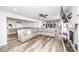 Open living area with fireplace, TV, sectional couch, dining area, and kitchen at 6599 Mcintosh Rd, Stanley, NC 28164