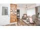 Cozy sitting area featuring seating, wood wall decor and access to laundry at 6599 Mcintosh Rd, Stanley, NC 28164