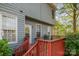 Stained back deck with table and BBQ, off the back of a two-story home at 6615 Wickville Dr, Charlotte, NC 28215