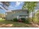 Expansive backyard featuring patio, lush greenery, and two-story home at 6615 Wickville Dr, Charlotte, NC 28215