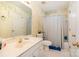 Well lit bathroom featuring a shower-tub combo with a neutral color palate at 6615 Wickville Dr, Charlotte, NC 28215