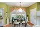 Cozy dining area featuring a round table, chairs, and natural light at 6615 Wickville Dr, Charlotte, NC 28215