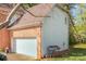 Attached two car garage, with driveway, brick and siding combination at 6615 Wickville Dr, Charlotte, NC 28215