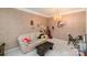 Living room with a chandelier, sofa and musical decor at 6615 Wickville Dr, Charlotte, NC 28215