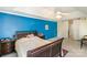 Spacious primary bedroom featuring a large bed, ceiling fan, and ample space at 6615 Wickville Dr, Charlotte, NC 28215