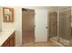 Bright bathroom showcasing a walk-in shower with tiled walls and a modern vanity at 729 Naramore St, Davidson, NC 28036