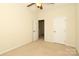 Bedroom featuring neutral carpet, fan, and door at 729 Naramore St, Davidson, NC 28036