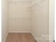 Spacious closet featuring carpet and shelves at 729 Naramore St, Davidson, NC 28036