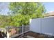 Deck area showcasing white railings and a view of lush greenery at 729 Naramore St, Davidson, NC 28036