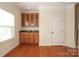 Dining area featuring a storage cabinet and a door to another part of the home at 729 Naramore St, Davidson, NC 28036