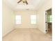 Spacious main bedroom with neutral carpet, natural light, and a tray ceiling at 729 Naramore St, Davidson, NC 28036