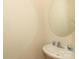 Well-lit powder room featuring a modern sink and faucet with a large mirror at 729 Naramore St, Davidson, NC 28036