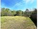 Large backyard with a mix of open grassy areas and tree coverage, perfect for recreation and relaxation at 7928 Ponderosa Pine Ln, Charlotte, NC 28215