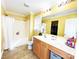 Full bathroom with tub shower, linoleum flooring, and a white vanity with a large mirror at 7928 Ponderosa Pine Ln, Charlotte, NC 28215