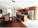 Spacious kitchen with granite counters, stainless steel appliances, and seamless access to the dining area at 7928 Ponderosa Pine Ln, Charlotte, NC 28215