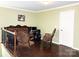 Cozy living room with hardwood floors, decorative trim, and comfortable seating at 7928 Ponderosa Pine Ln, Charlotte, NC 28215