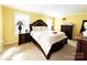 Comfortable main bedroom features a large bed with ornate details, side tables, and plush carpeting at 7928 Ponderosa Pine Ln, Charlotte, NC 28215
