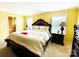 Bright main bedroom showcases a large bed, bedside tables, and natural light from two windows at 7928 Ponderosa Pine Ln, Charlotte, NC 28215