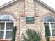 Exterior view of the clubhouse featuring stone design with a 'Clubhouse Swimming Pool' sign at 811 Wynnshire Dr # A, Hickory, NC 28601
