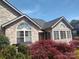 Stylish home exterior with stone accents, arched windows, and manicured landscaping at 811 Wynnshire Dr # A, Hickory, NC 28601