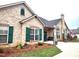 Charming exterior view of a stone clubhouse featuring green shutters and manicured landscaping at 811 Wynnshire Dr # A, Hickory, NC 28601